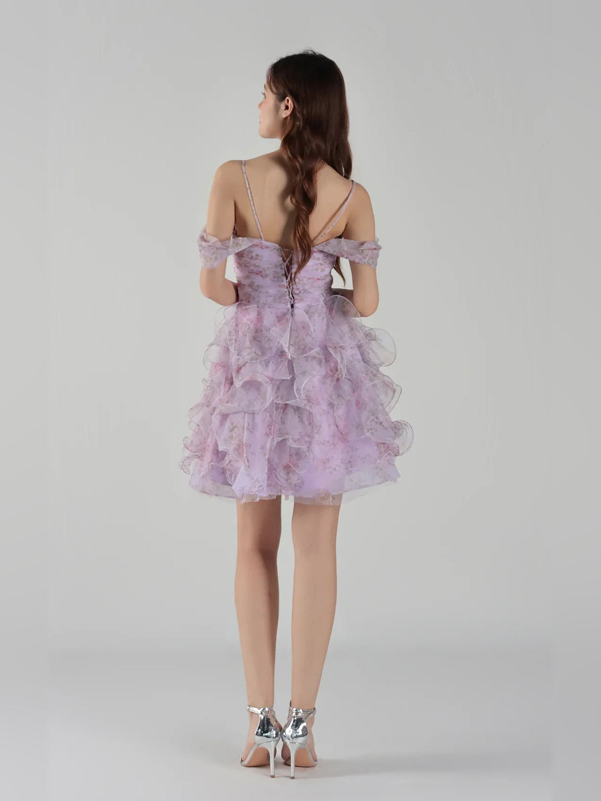 Light purple tulle mini dress, back view with off-shoulder ruffle sleeves and tiered skirt