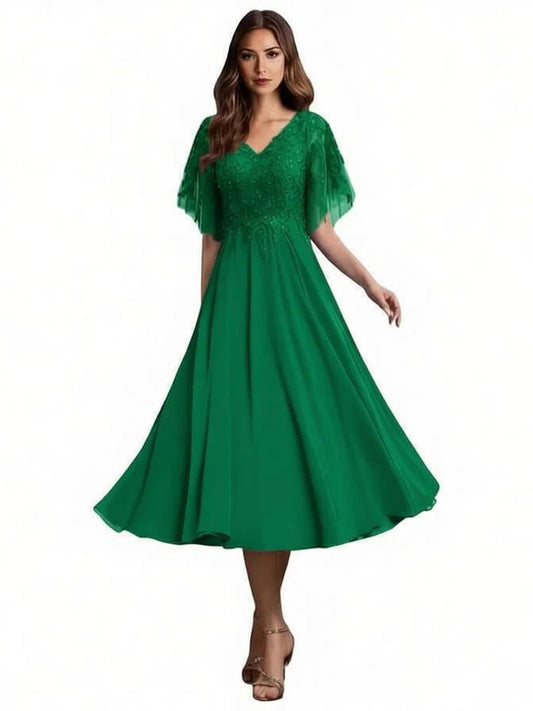 Emerald green V-neck beaded A-line tea-length formal dress with a flowing skirt