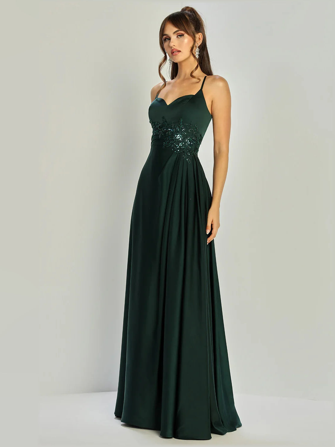 Dark green sweetheart formal dress with beaded bodice and A-line floor-length skirt