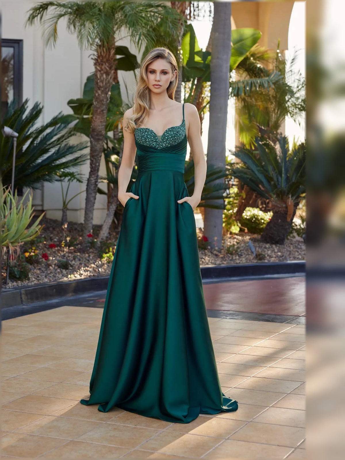 Peacock green sweetheart A-line formal dress with beaded bodice and ruched waist, full-length