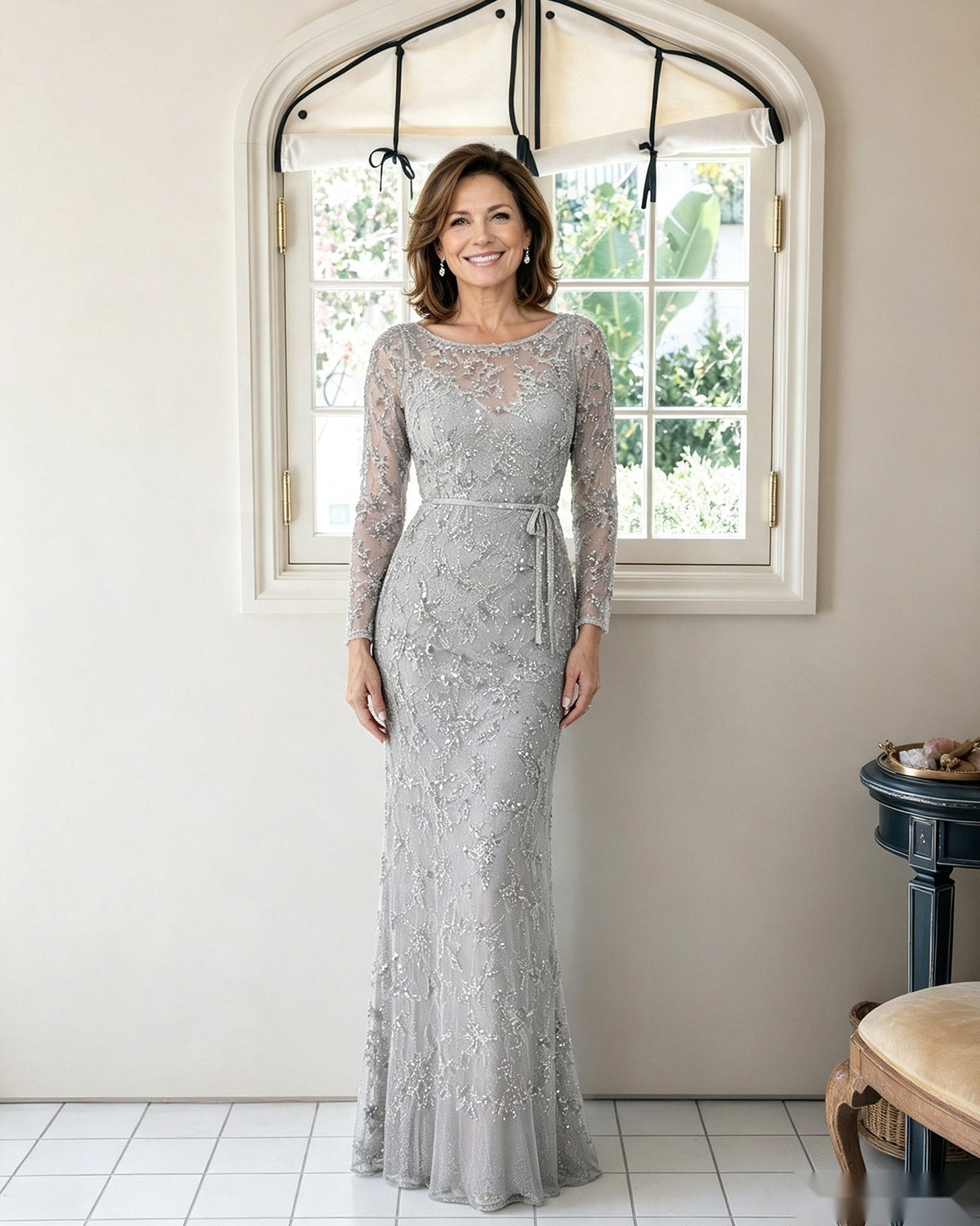 Illusion lace sheath dress in light silver gray with long sleeves and fitted floor-length silhouette