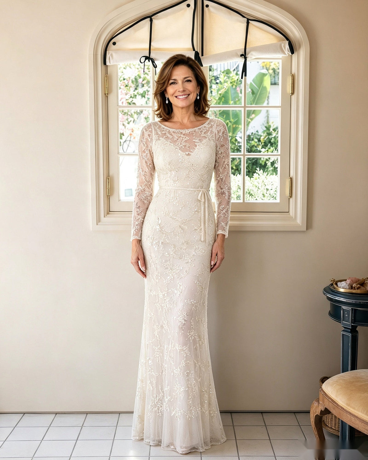 Illusion lace sheath dress in ivory with long sleeves and fitted floor-length silhouette
