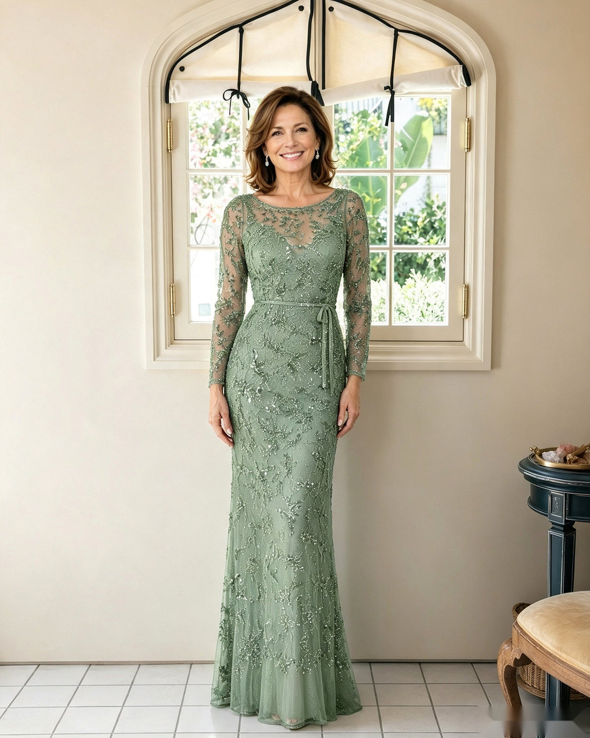 Illusion lace sheath dress in dusty sage green with long sleeves and fitted floor-length silhouette