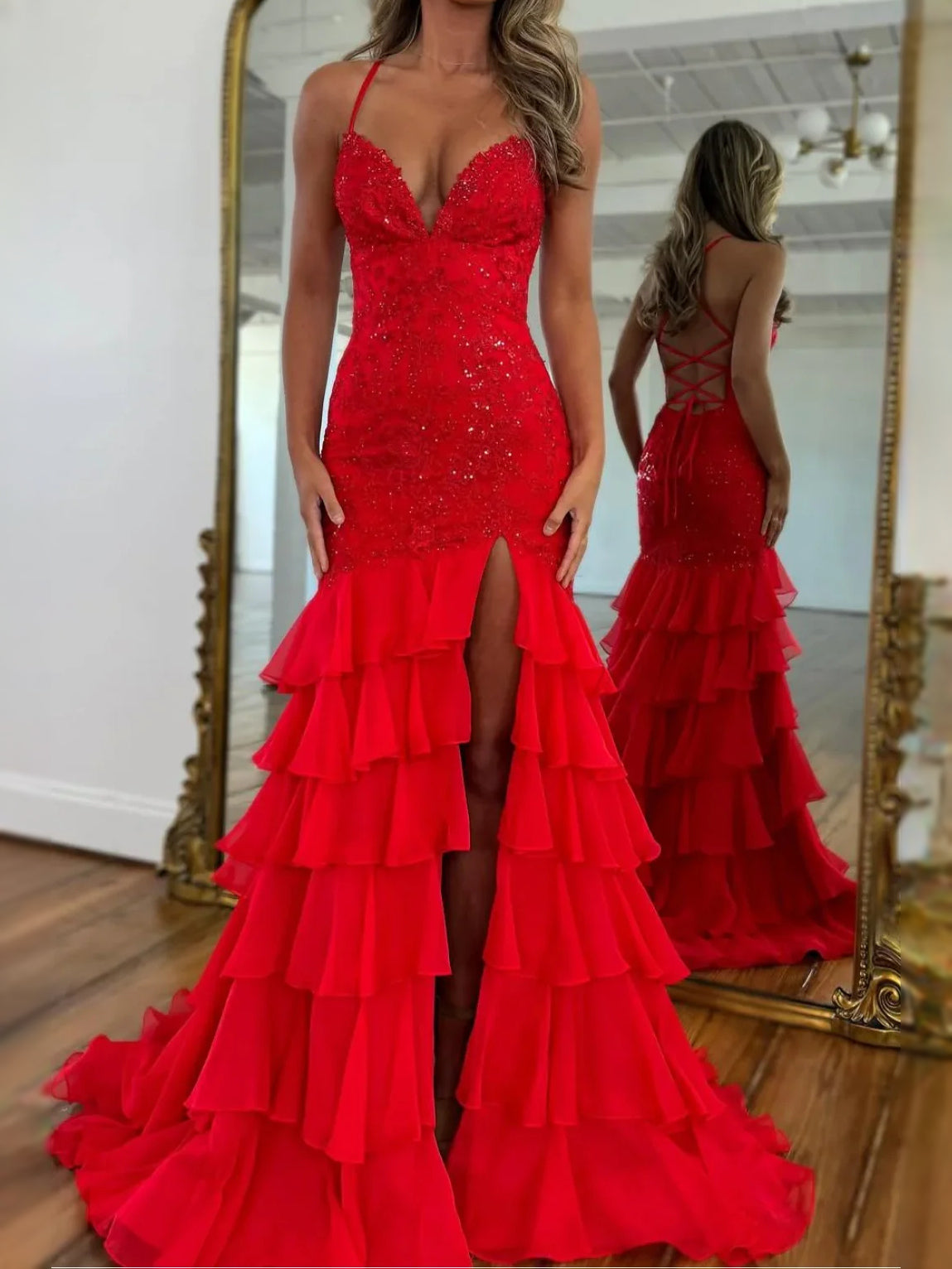 Red strapless mermaid prom dress with glitter bodice, tiered ruffle skirt and front slit