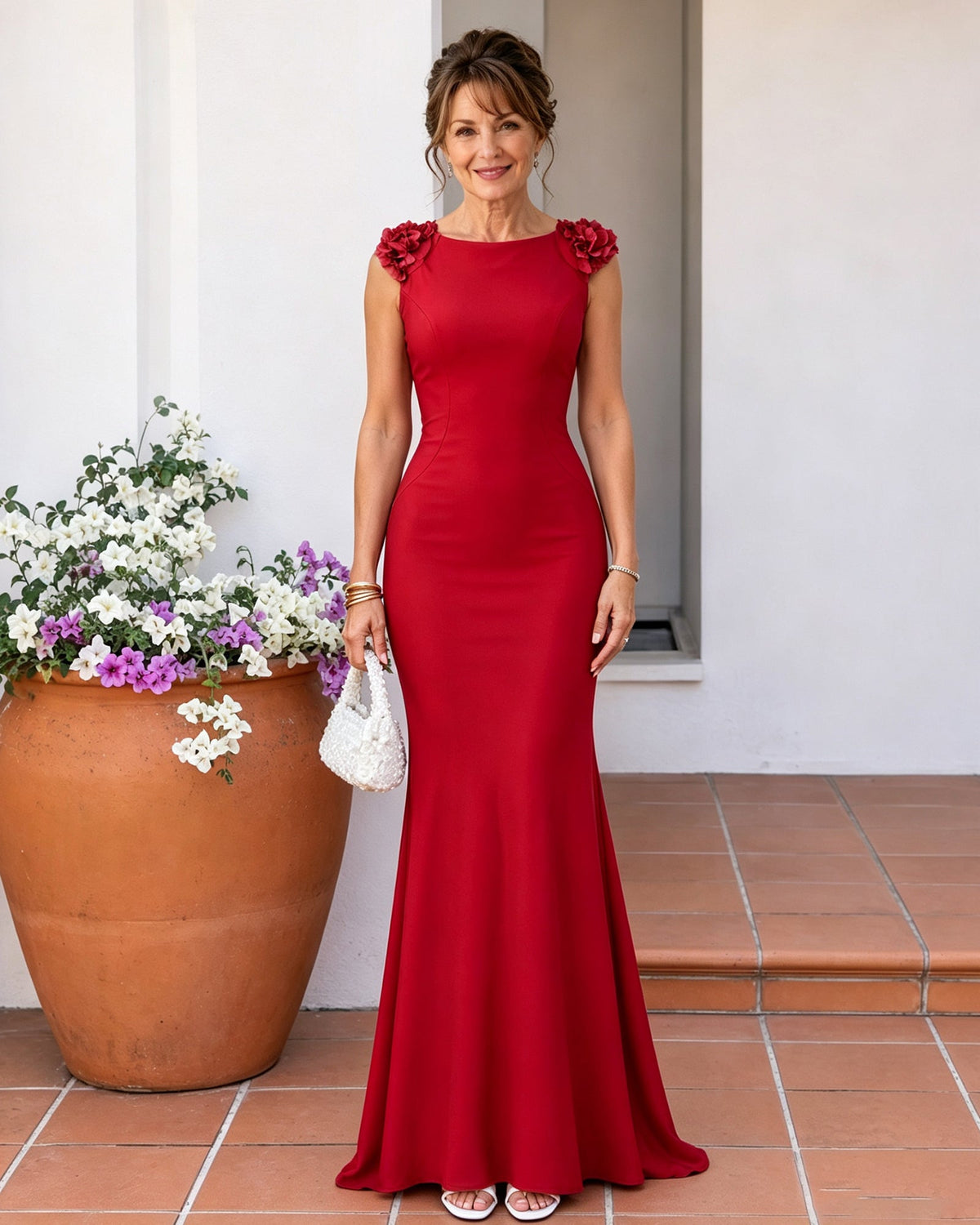 Red mermaid mother-of-the-bride dress with floral ruffled shoulders and long flared hem