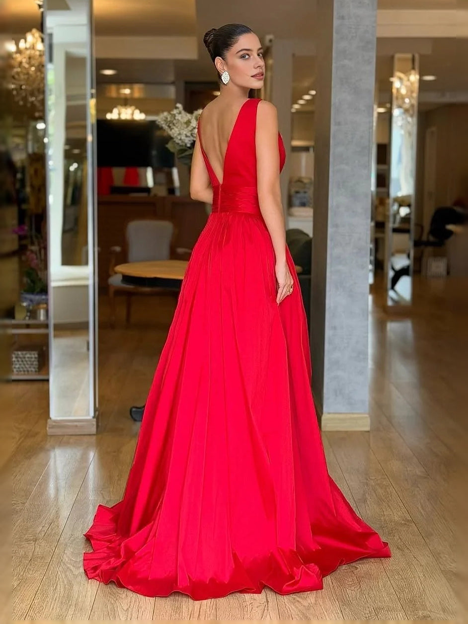 Red V-neck A-line prom dress with ruched pleats, low V-back and flowing floor length