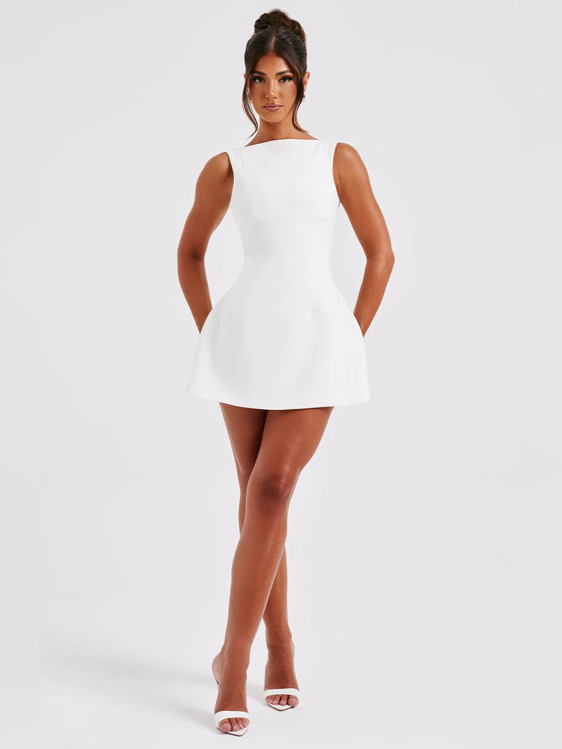 Ivory mini sleeveless dress with sleeveless high neck and A-line skirt