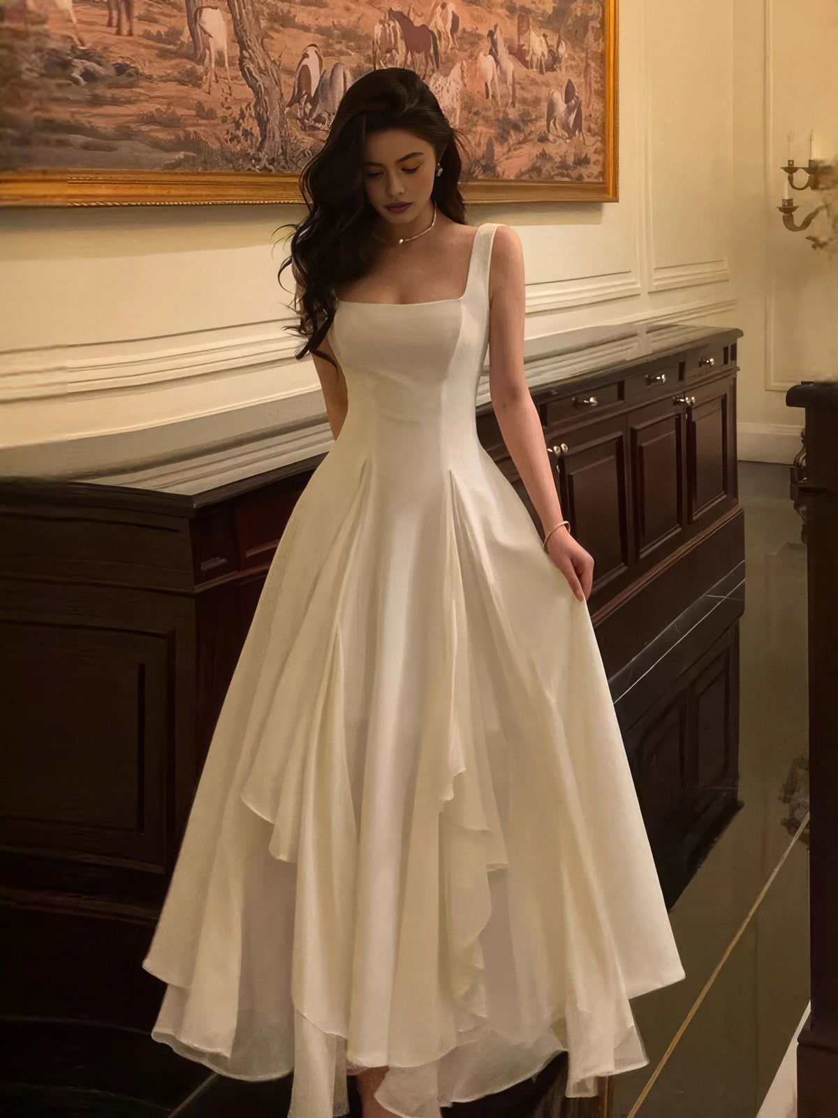 Ivory square-neck A-line wedding dress, layered floor-length skirt and sleeveless bodice