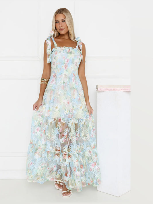 Light blue floral maxi dress with square neckline, thin straps, and lace-edged tiers