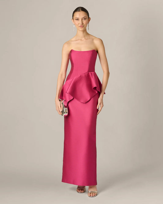 Bright rose strapless maxi dress with flowing front ruffle peplum