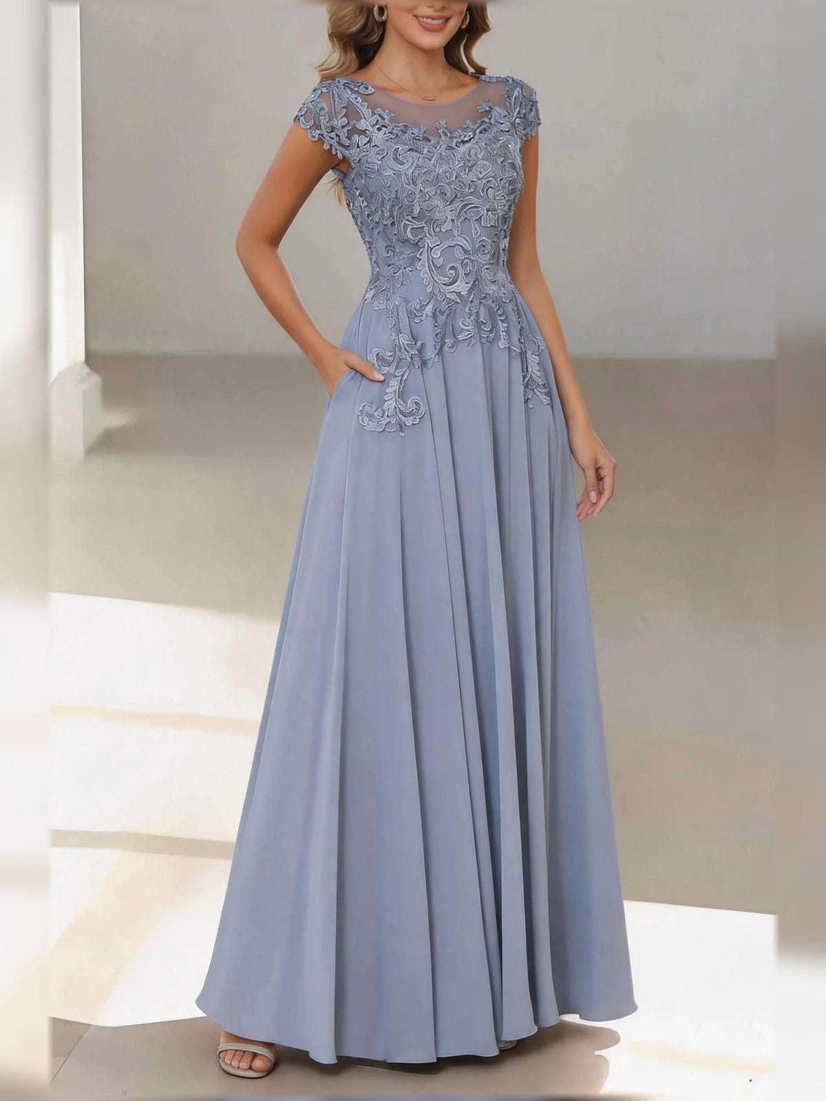Dusty blue satin A-line dress with lace bateau neck and cap sleeves, pleated hem