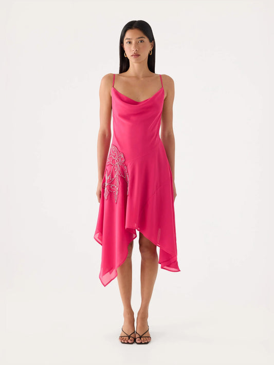 Fuchsia beaded midi dress with asymmetric draped hem and beaded floral detail at hip