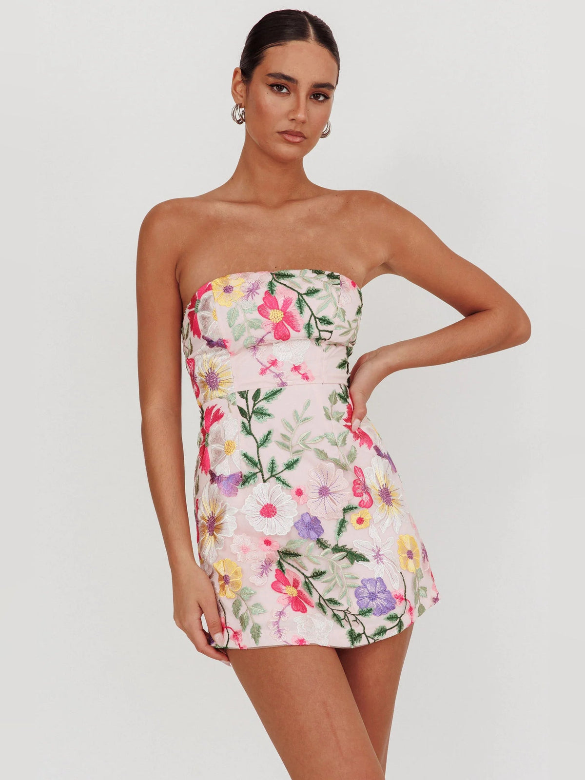 Floral strapless mini dress front view, fitted bodice, multicolor blooms