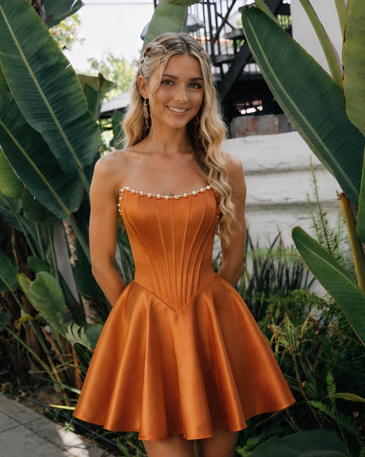Strapless satin homecoming dress with pearl trim, corset bodice, flared skirt—copper orange