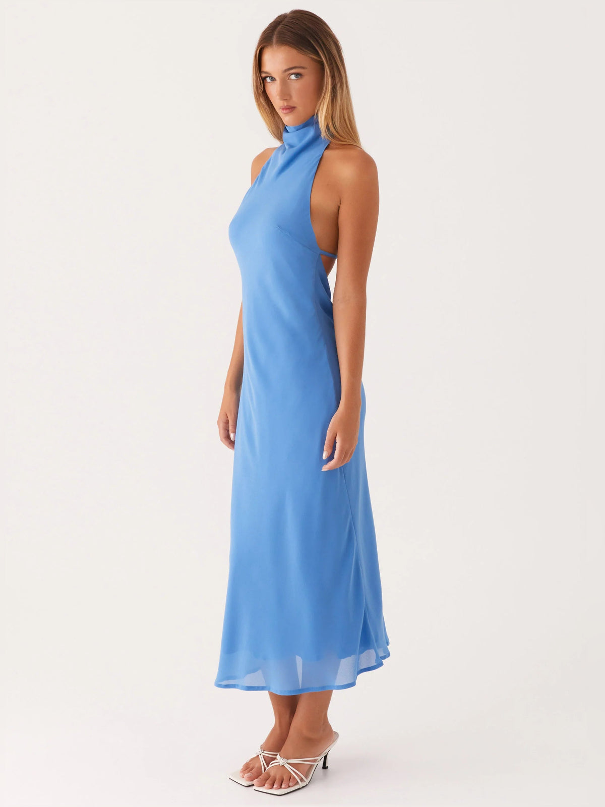 Azure halter midi formal dress, side profile with sleeveless high neck and layered hem
