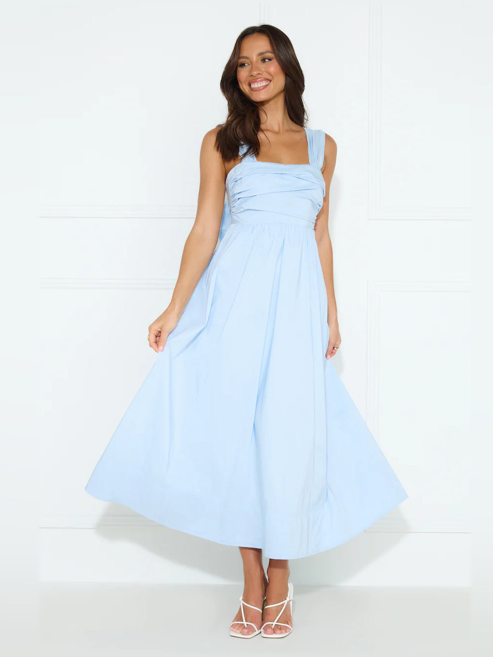Light blue sleeveless midi dress with square neckline and gathered waist, full skirt