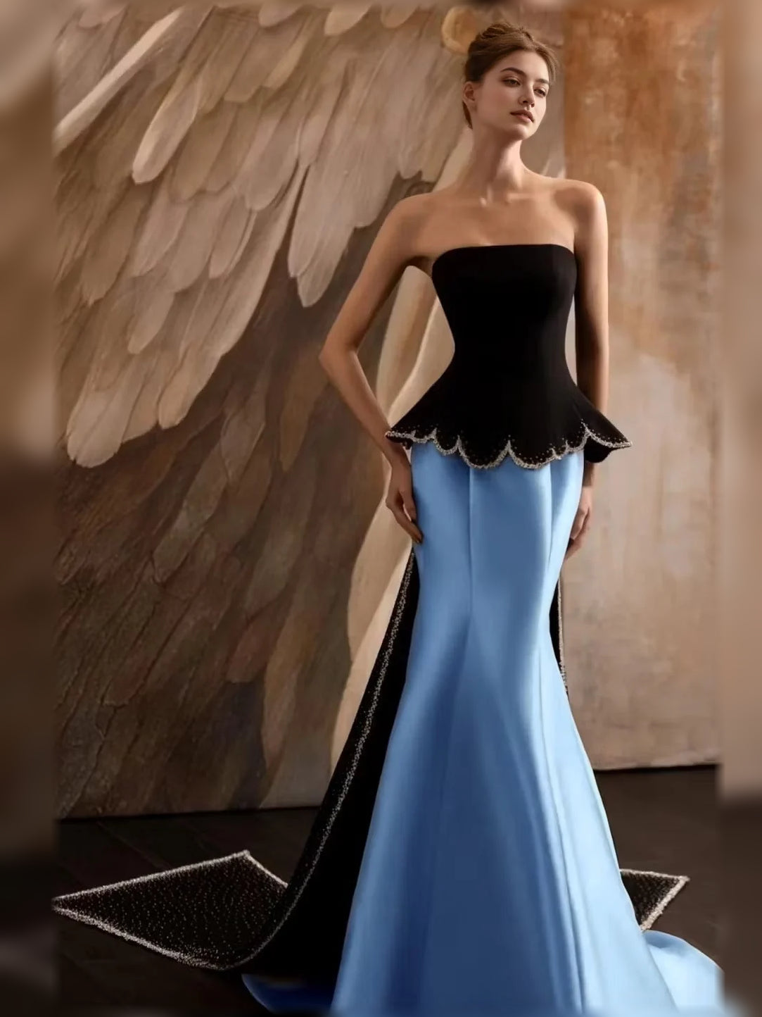 Light blue strapless mermaid formal dress with black scalloped peplum bodice
