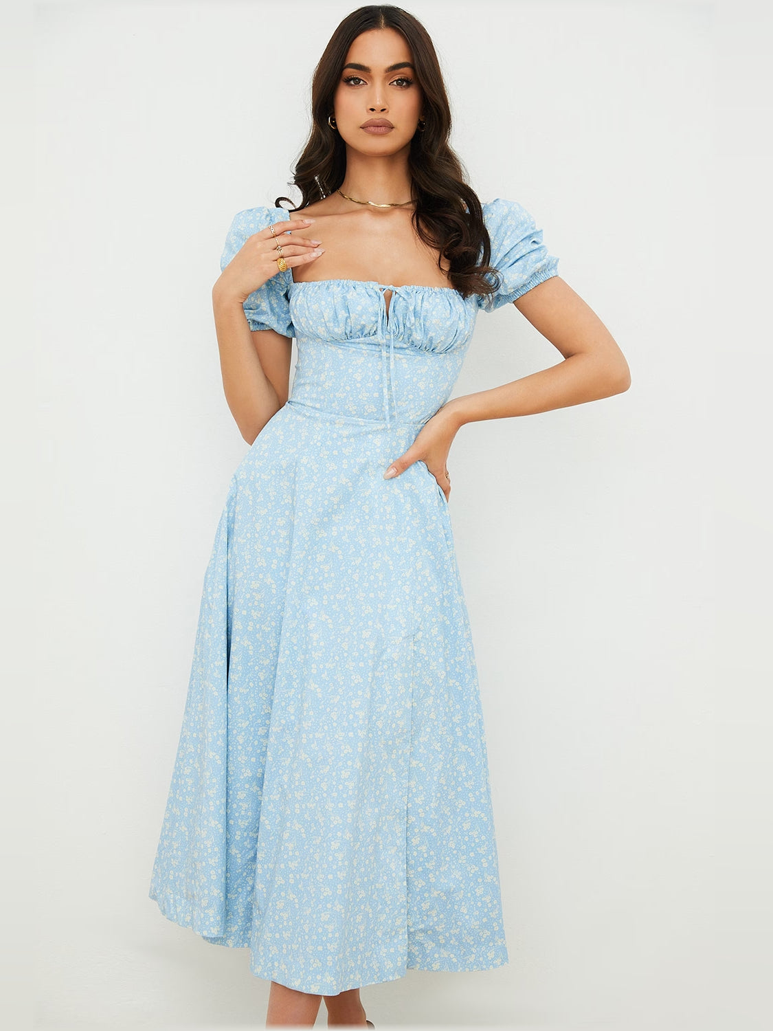 Light blue puff-sleeve midi dress with square neckline and ruched bodice, floral print