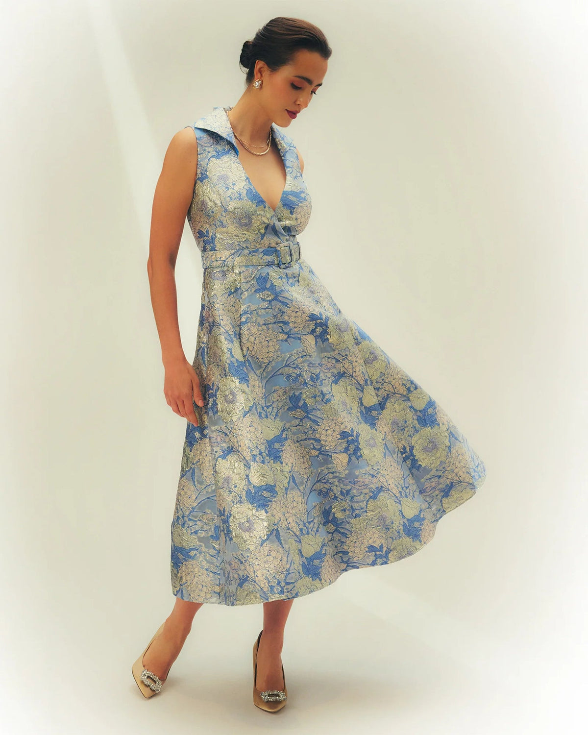Blue and white floral A-line midi dress with sleeveless V neckline and waist belt