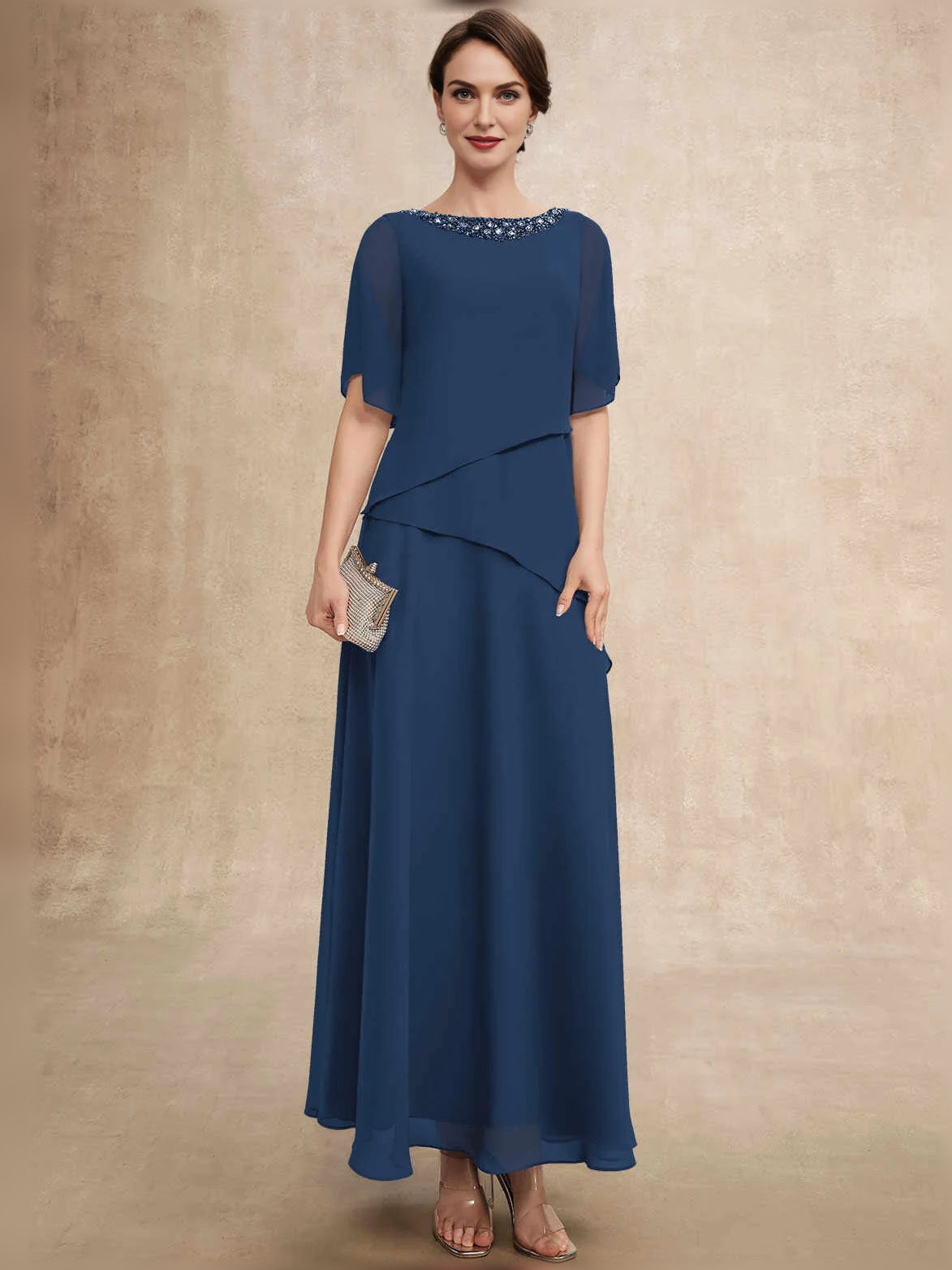 Dark navy chiffon A-line dress with beaded boat neckline and layered, flowing skirt