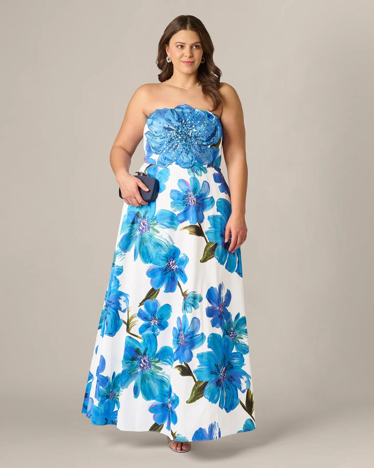 Full-length strapless A-line maxi dress with blue floral print and beaded sweetheart bodice