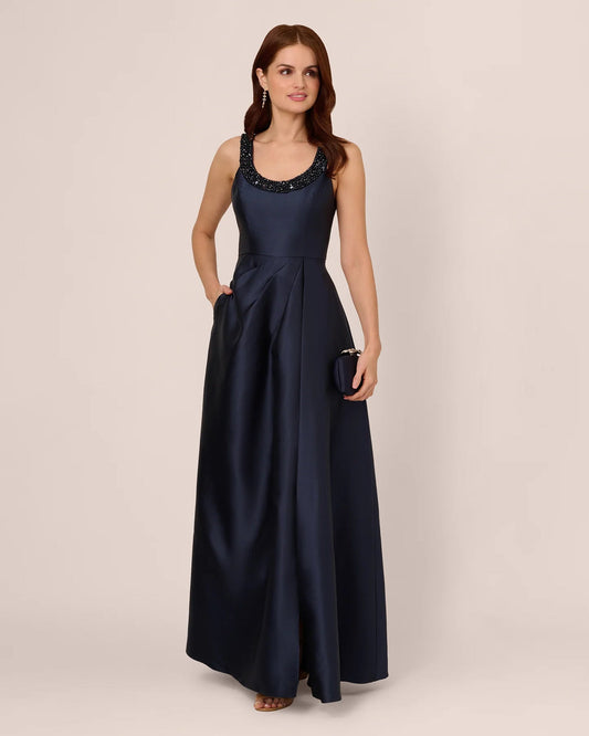 Midnight blue sleeveless fit-and-flare maxi dress with beaded scoop neckline, full length