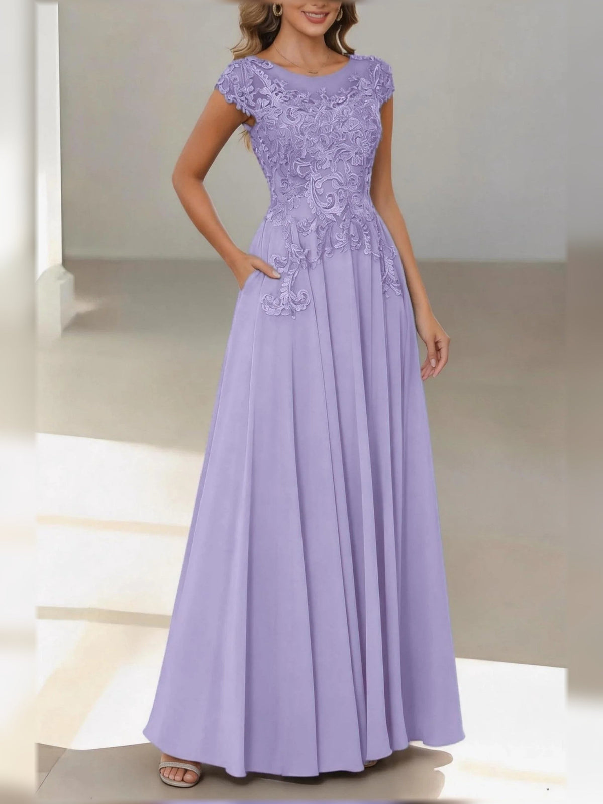 Lilac satin A-line dress with lace bateau neck, cap sleeves, and pleated floor-length skirt