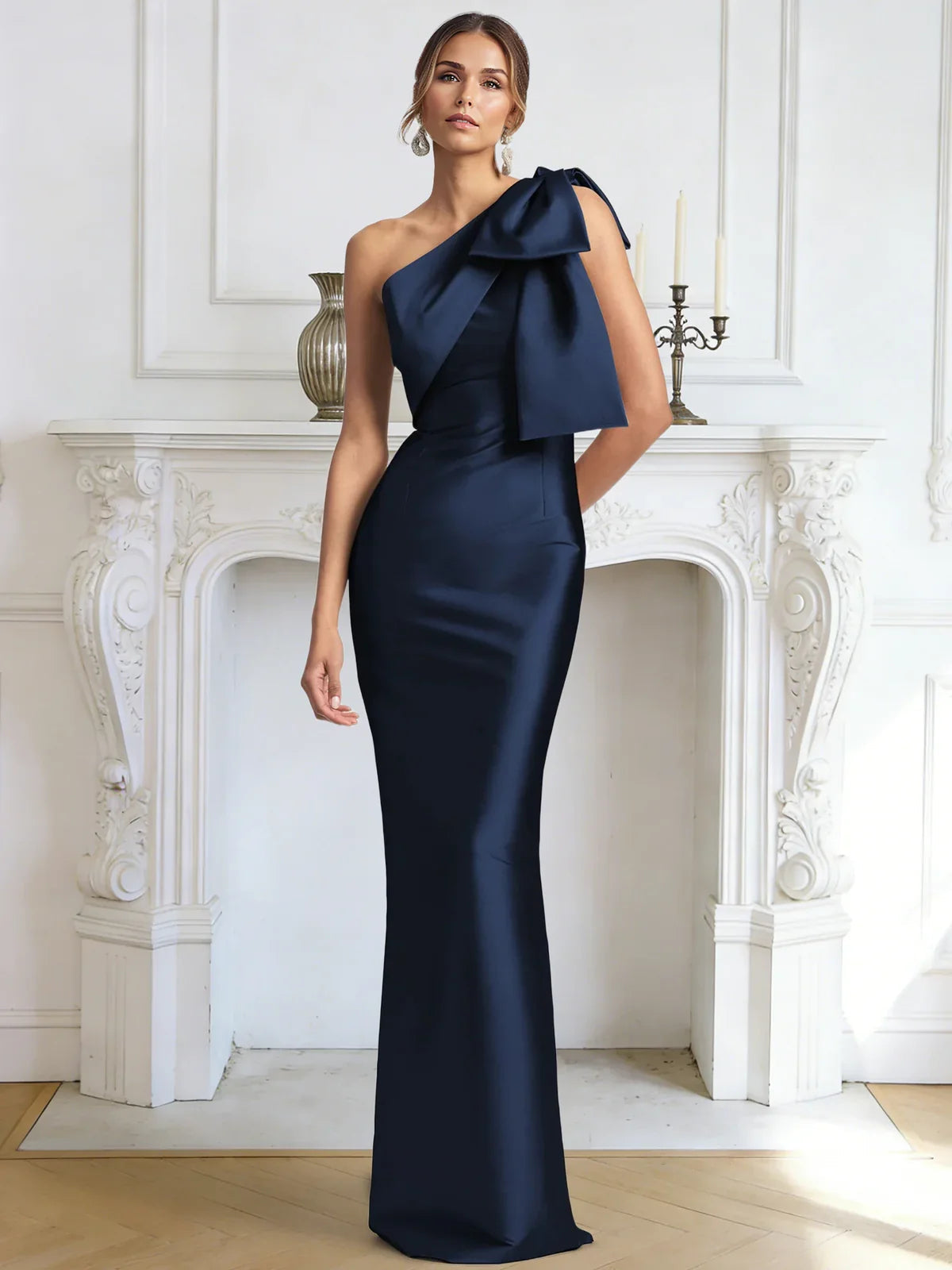 Dark navy one-shoulder bow mermaid gown with high slit, three-quarter view