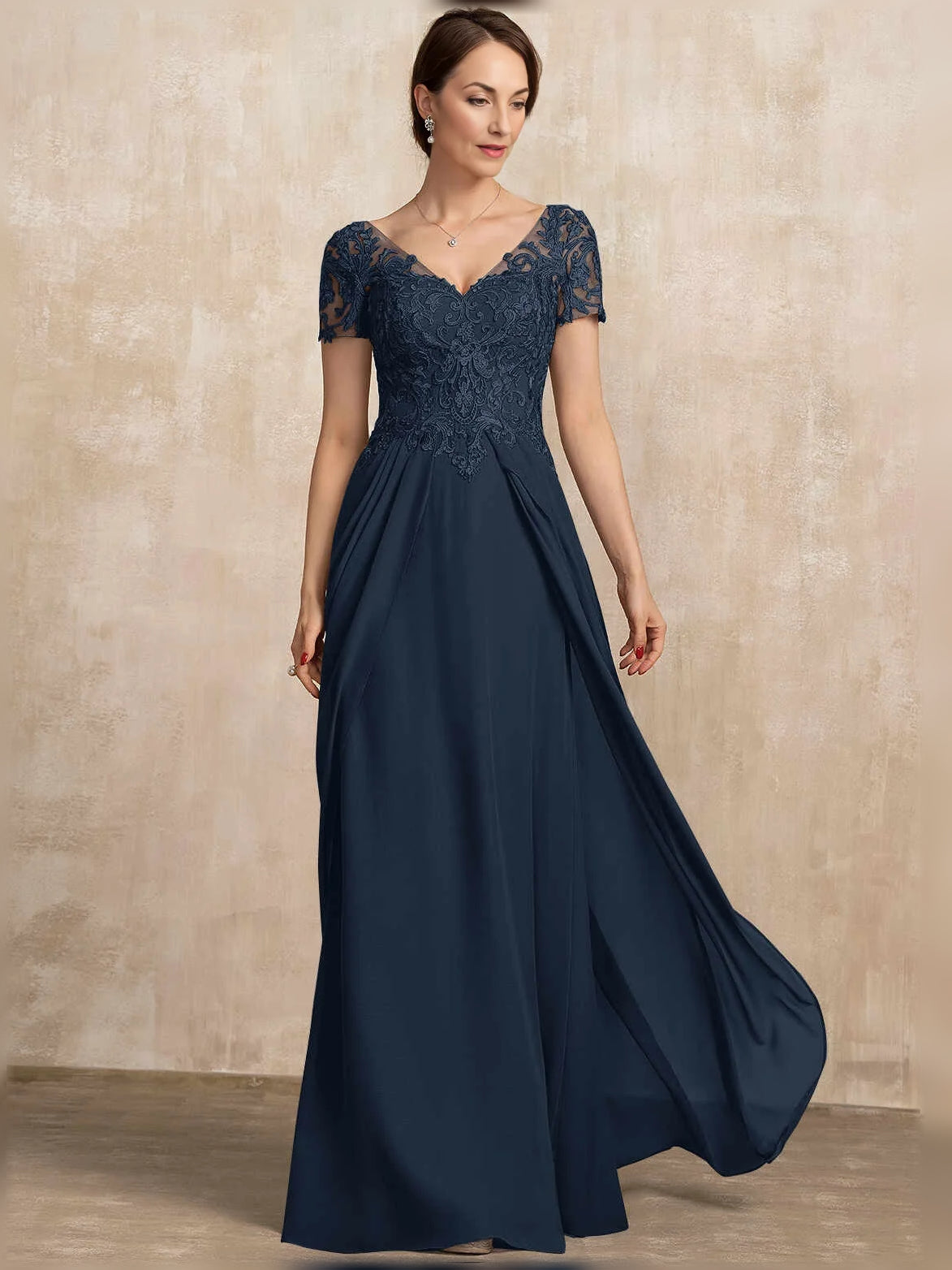 Dark blue front view V-neck chiffon A-line dress with lace bodice and flowing side slit