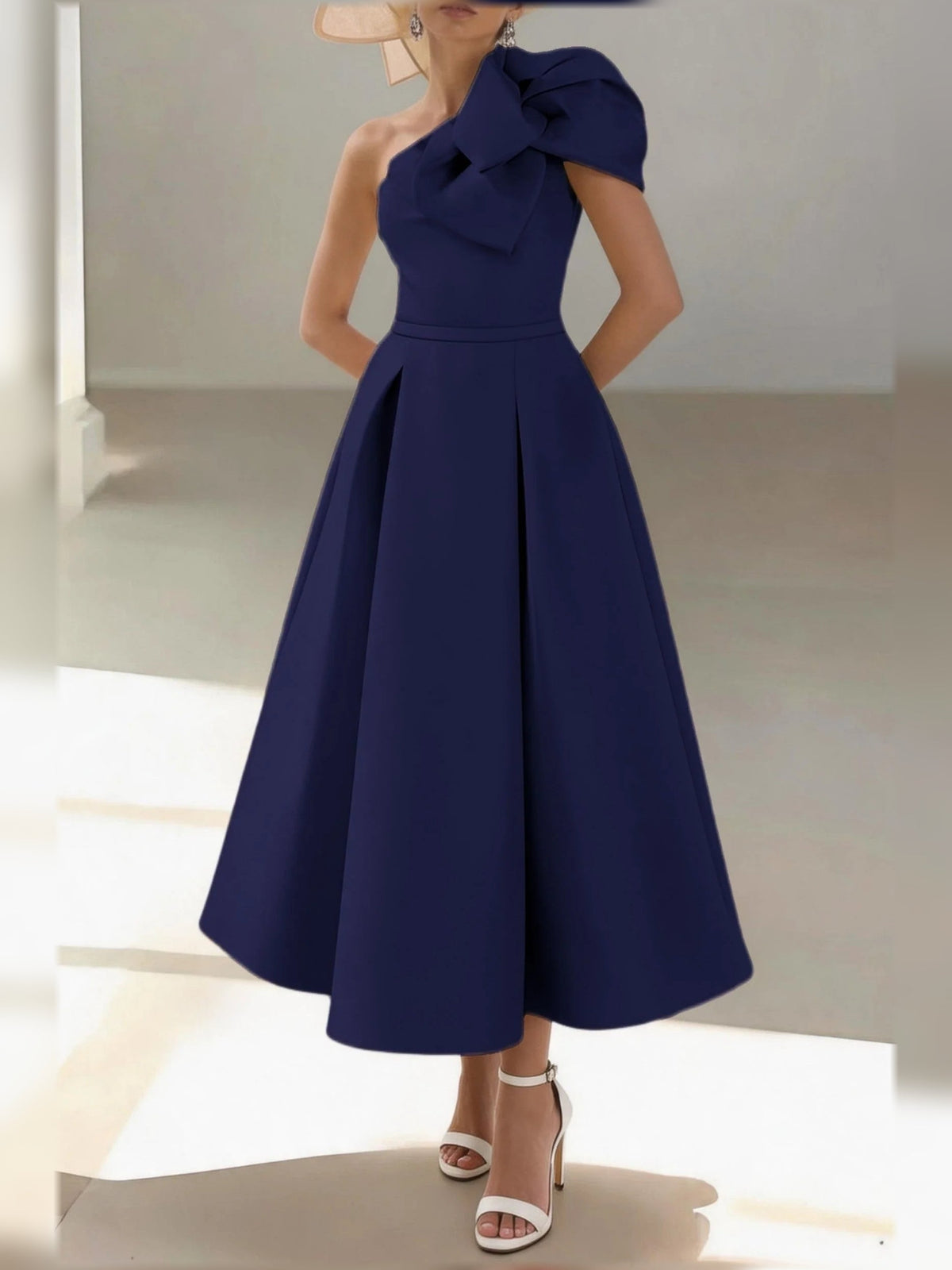 Dark navy one-shoulder satin A-line midi dress with pleated waist and bow shoulder