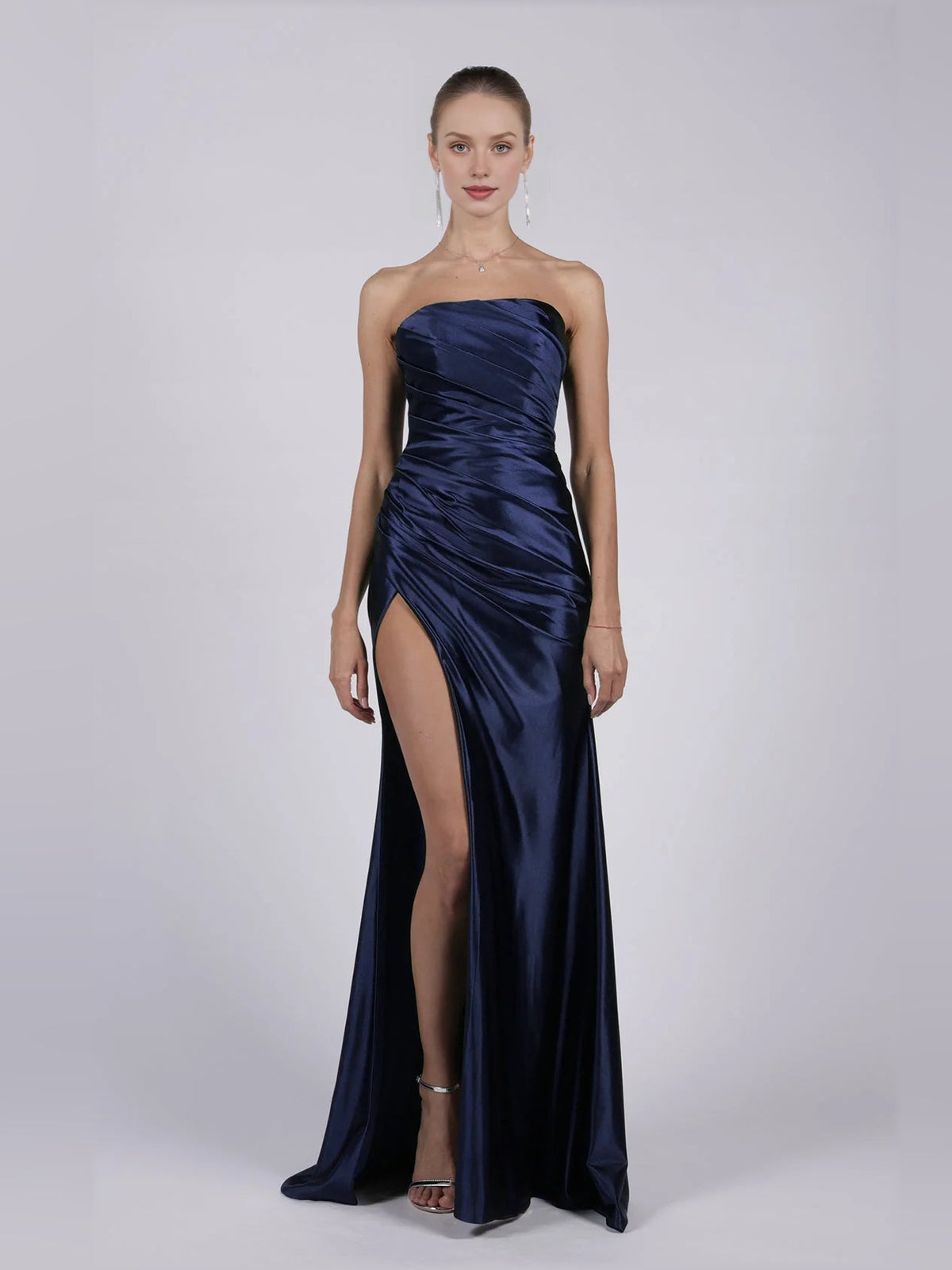 Strapless dark navy mermaid formal gown with ruched bodice and thigh-high slit