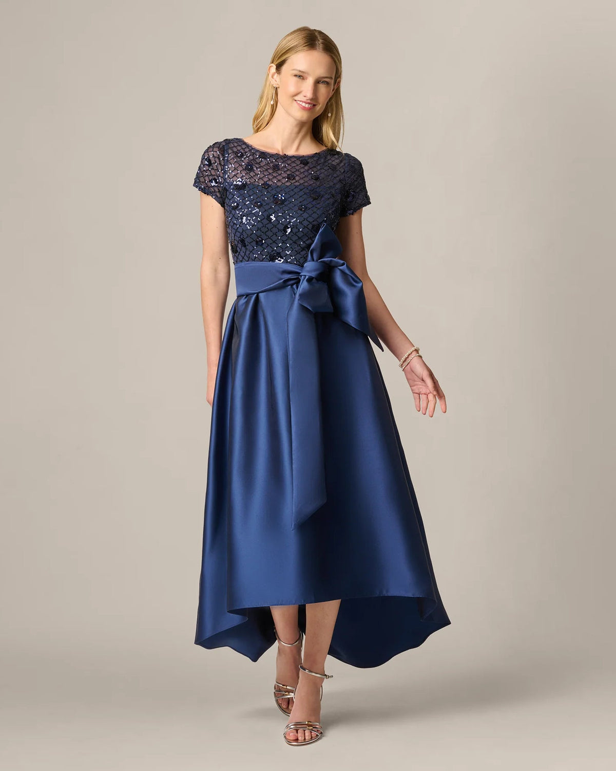 Navy embellished maxi dress with sequin bodice and satin bow belt, full-length flare