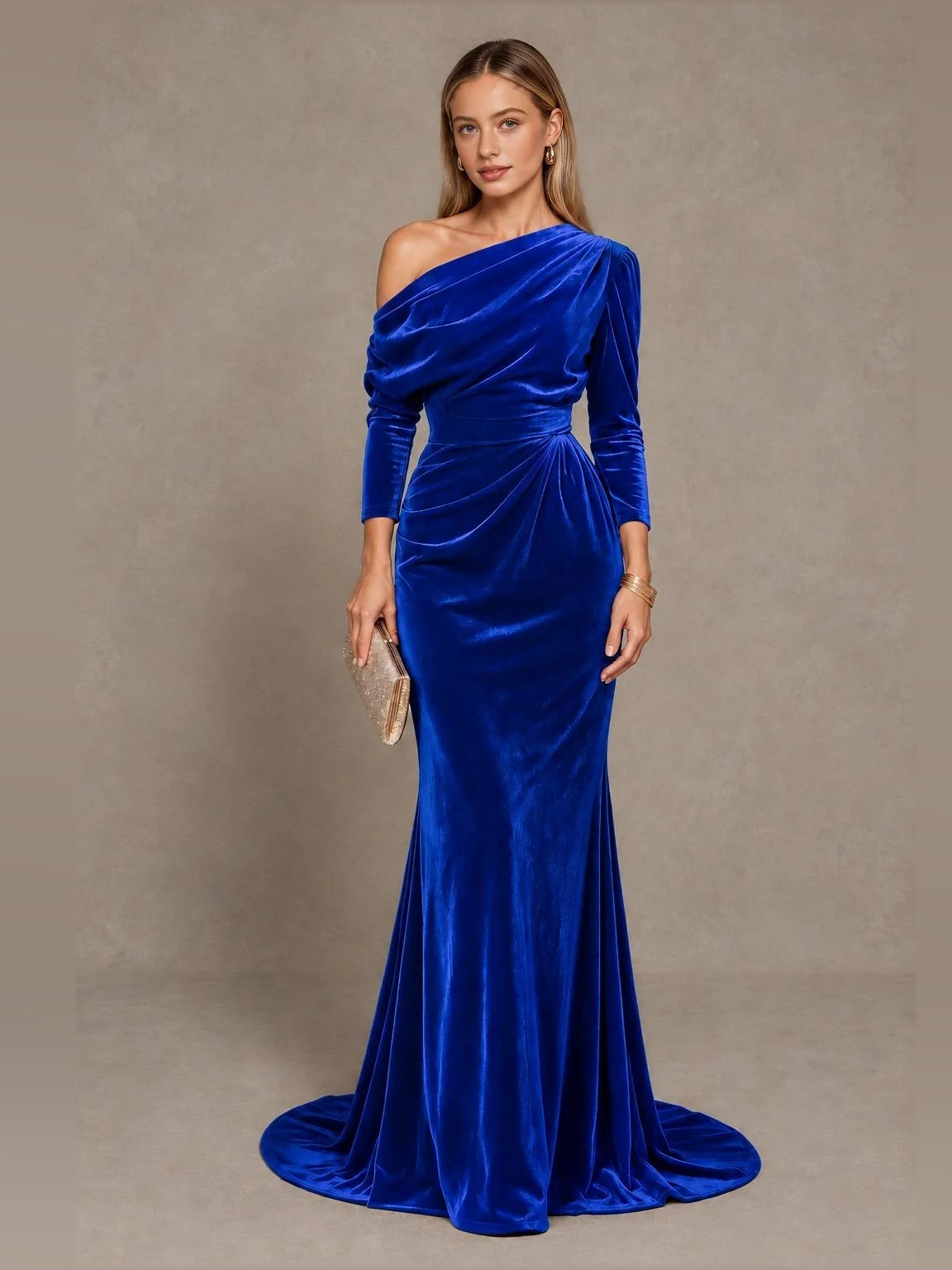 Royal blue velvet one-shoulder mermaid gown with draped bodice and long sleeve