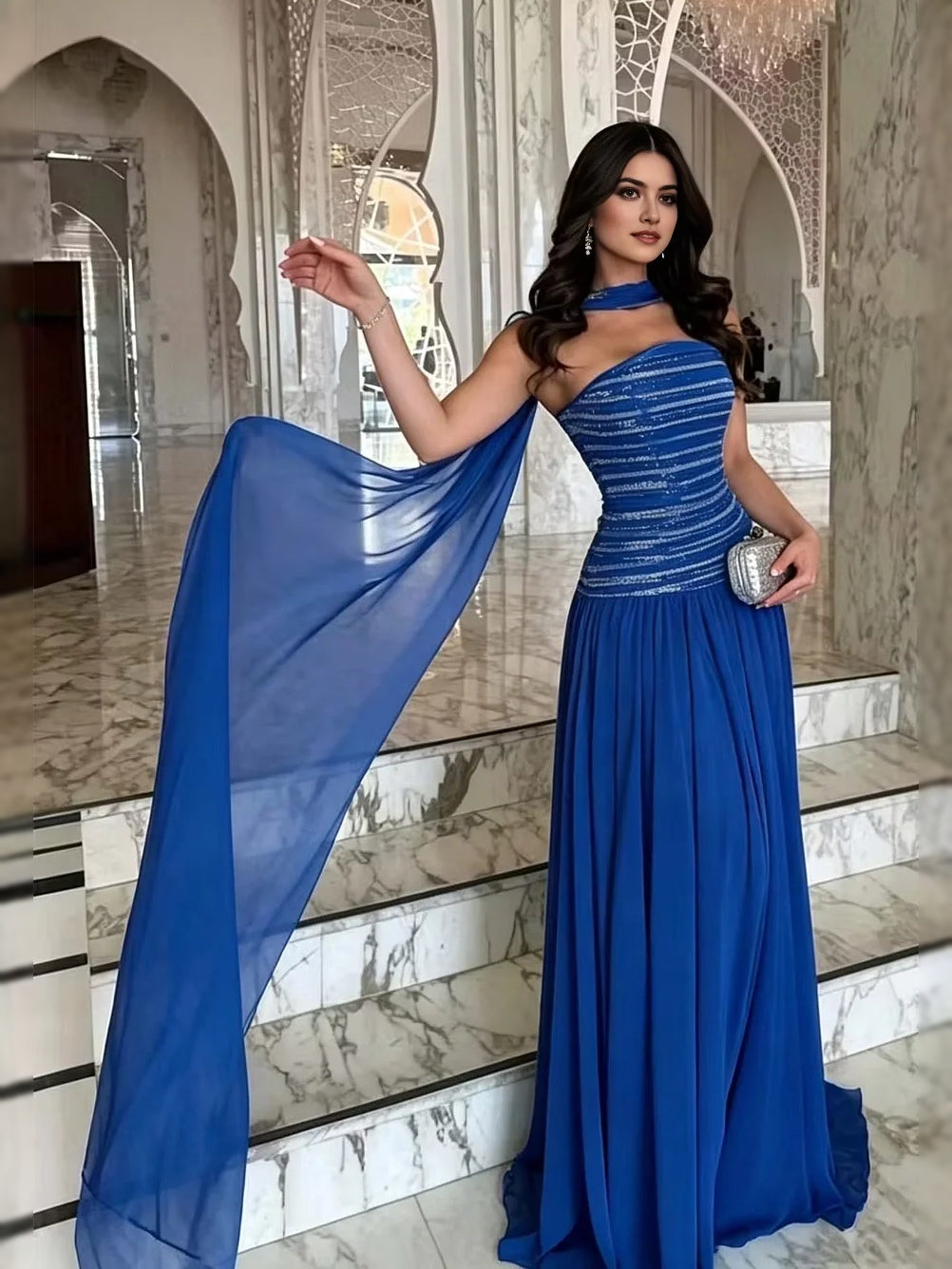 One-shoulder A-line prom dress in royal blue with beaded bodice and flowing side drape