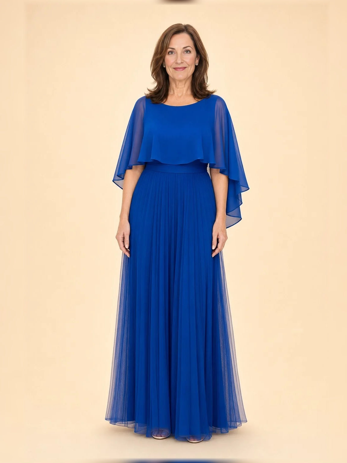 Navy pleated A-line dress with one-shoulder ruffled cape overlay, floor length