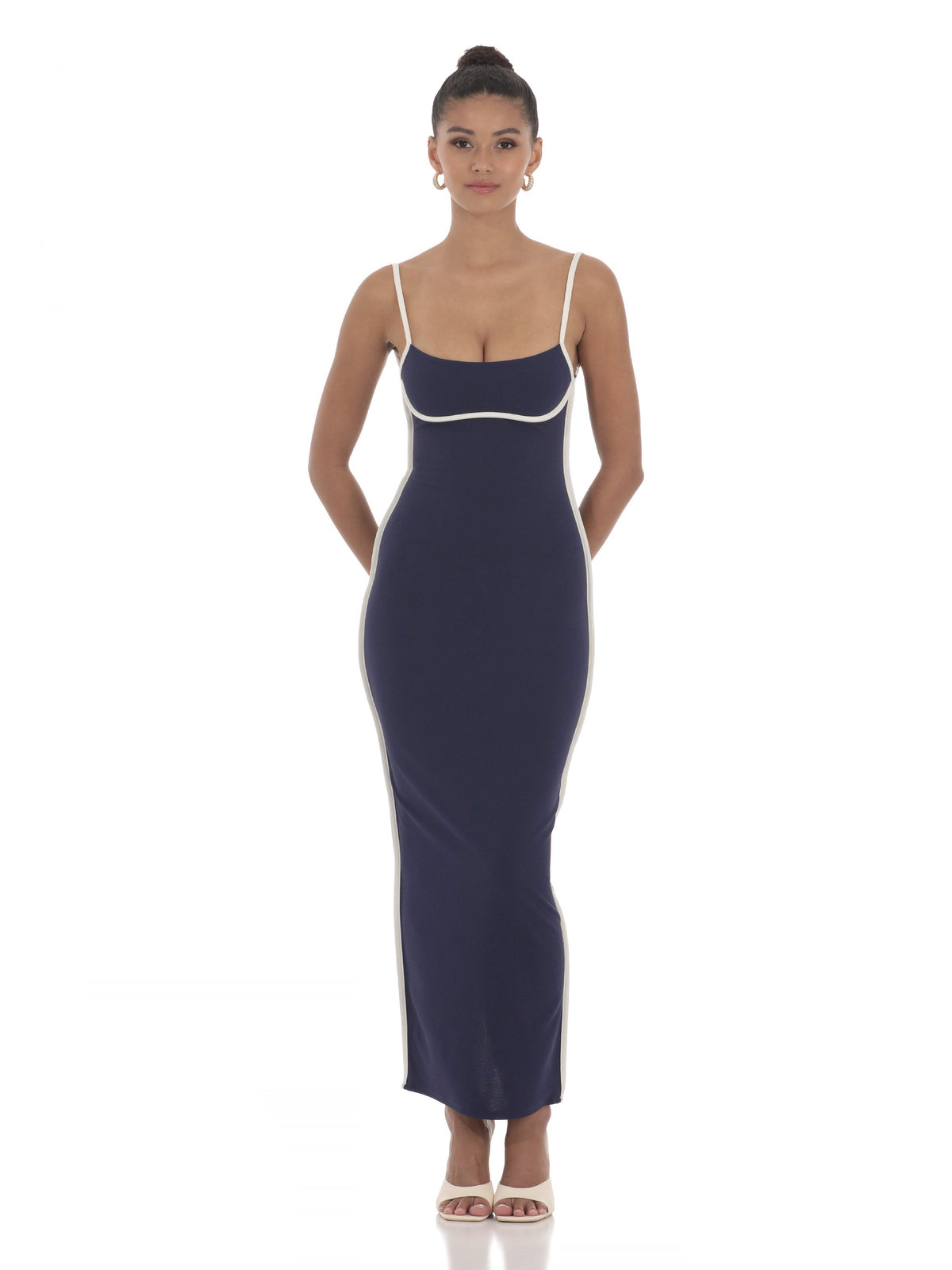 Navy sleeveless maxi dress with spaghetti straps, white-trim neckline and fitted waist