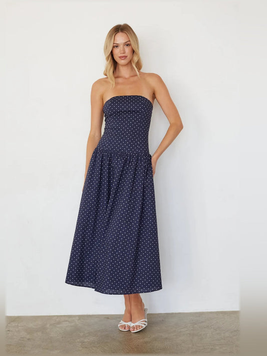 Navy polka dot strapless midi dress with gathered waist and flared skirt