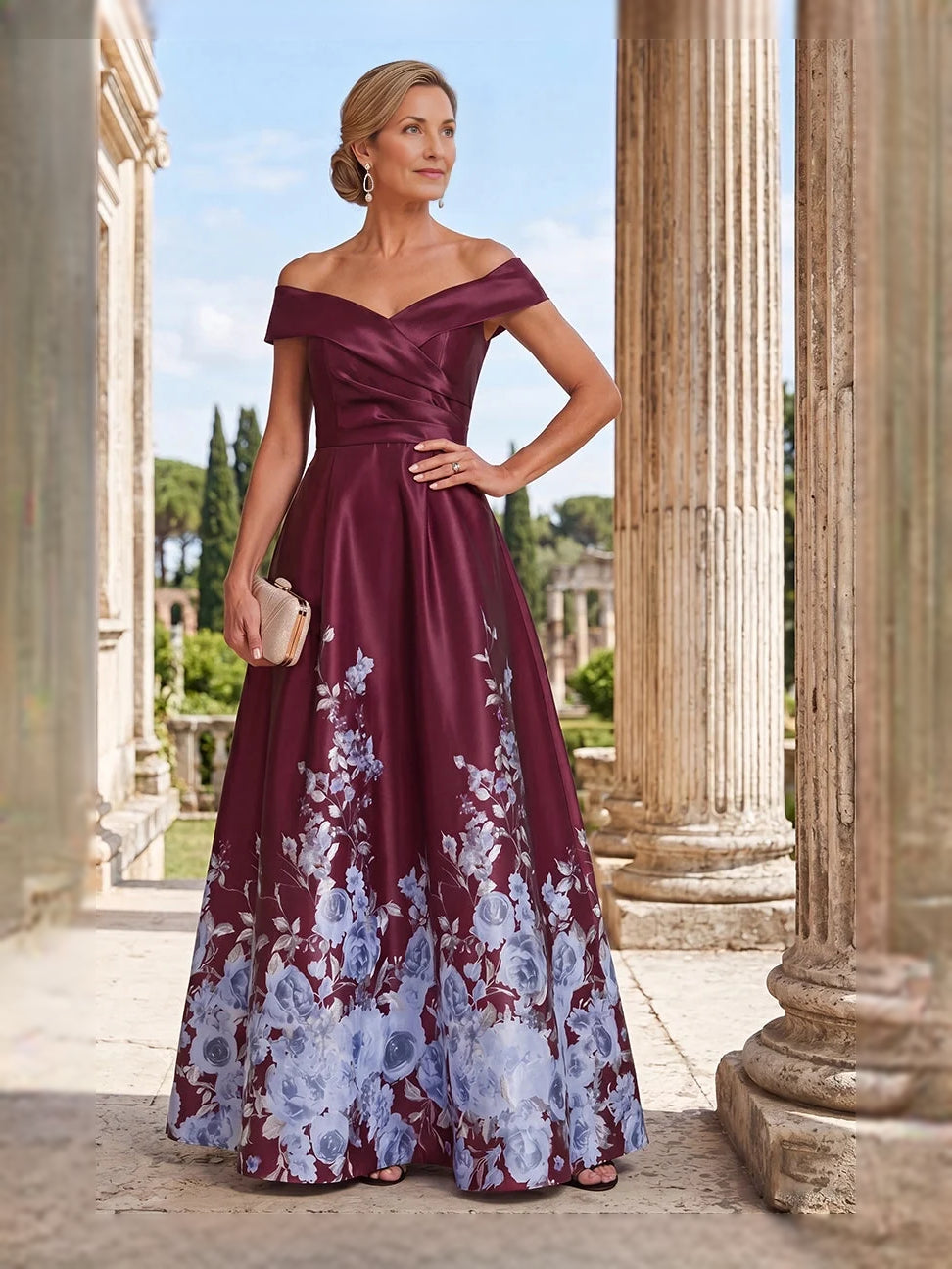 Off-shoulder satin A-line floor-length gown in deep maroon with white floral print skirt