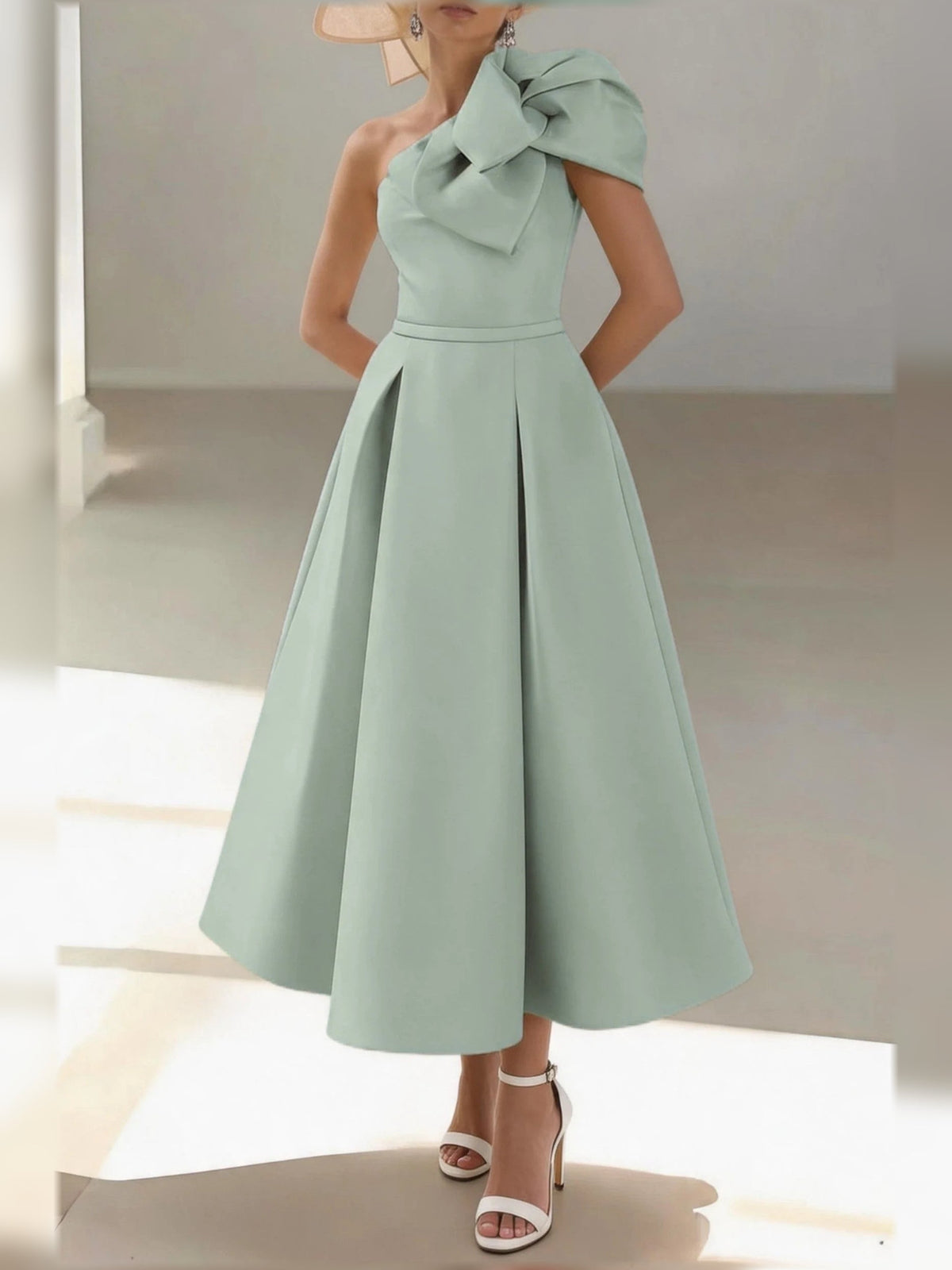 One-shoulder satin midi dress with pleated drape bodice and A-line skirt in mint green