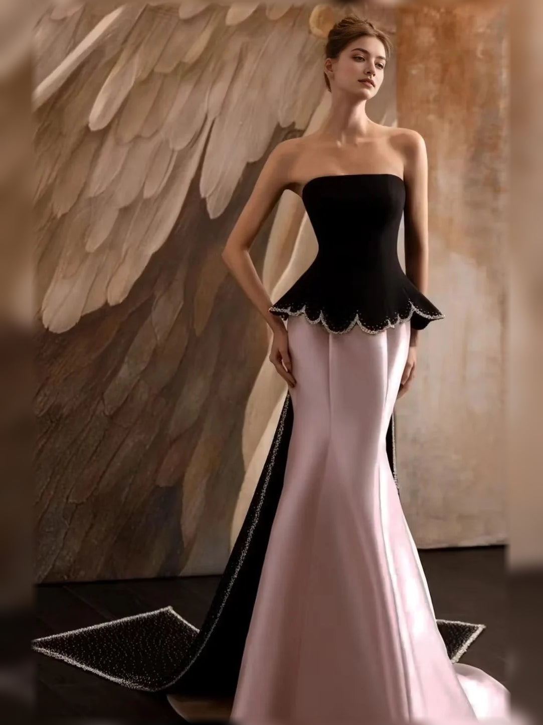 Champagne pink strapless mermaid formal dress with black scalloped peplum bodice