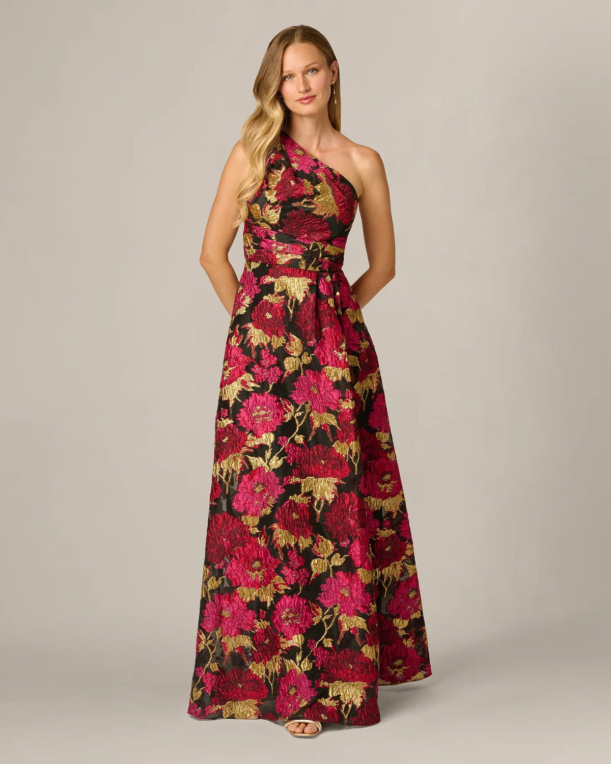 Floral one-shoulder A-line maxi dress with cinched waist, dark base and bright pink blooms