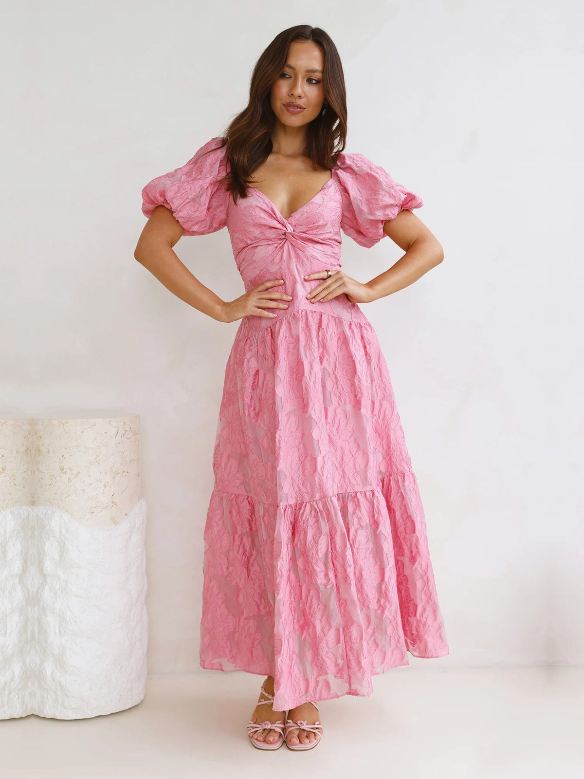 Pink V-neck tiered maxi dress with puff sleeves and gathered waist detail