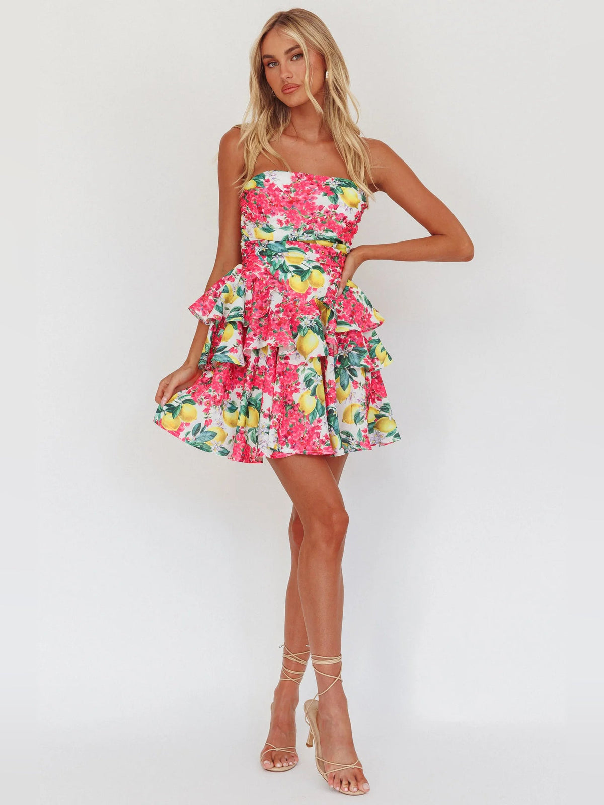 Pink strapless mini dress with lemon floral print and layered ruffled skirt