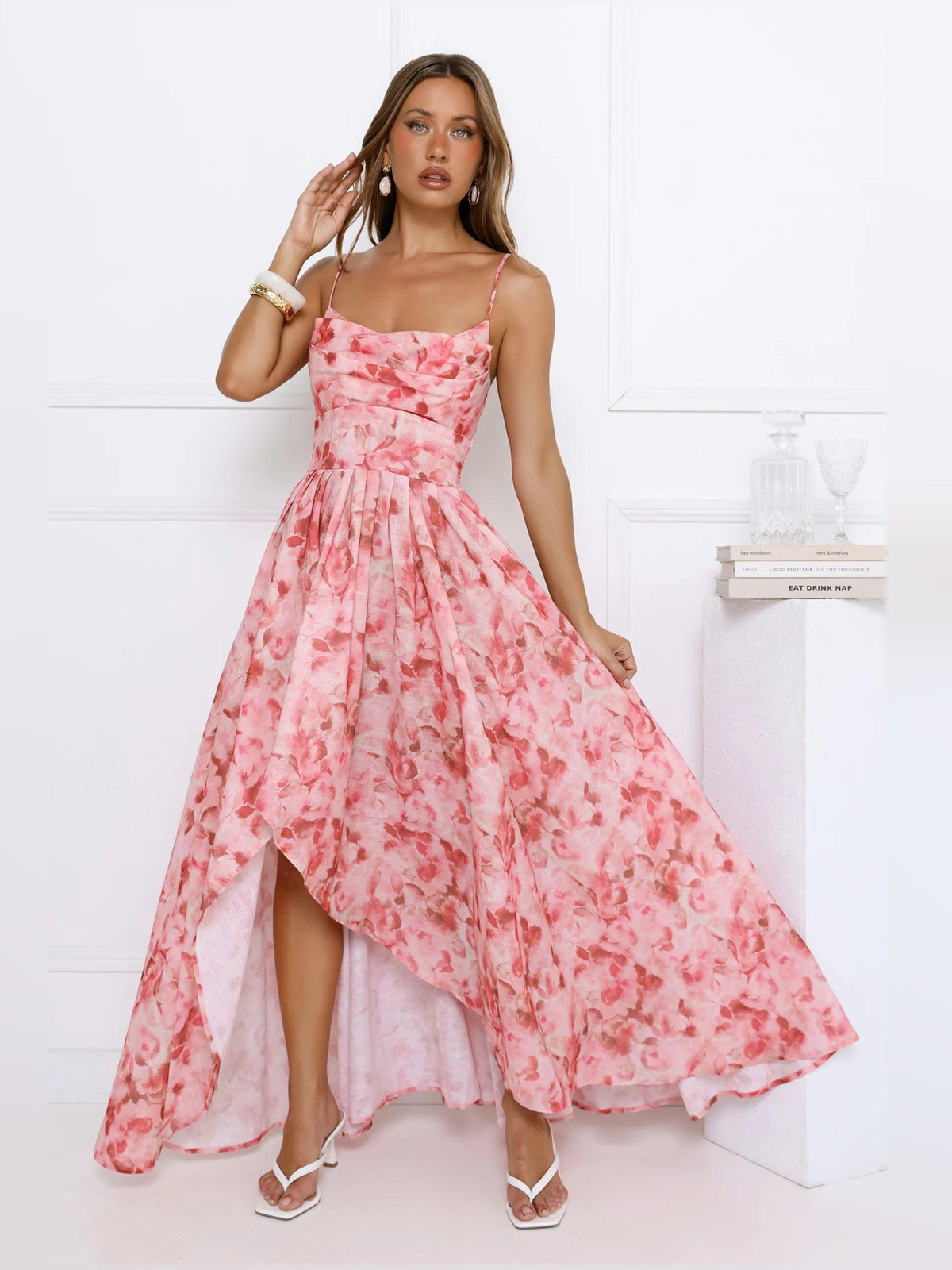 Pink floral midi formal dress front view with thin straps and airy tiered hem