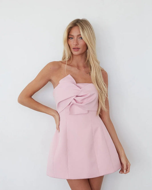Pink strapless mini homecoming dress with rosette twist and flared bubble skirt
