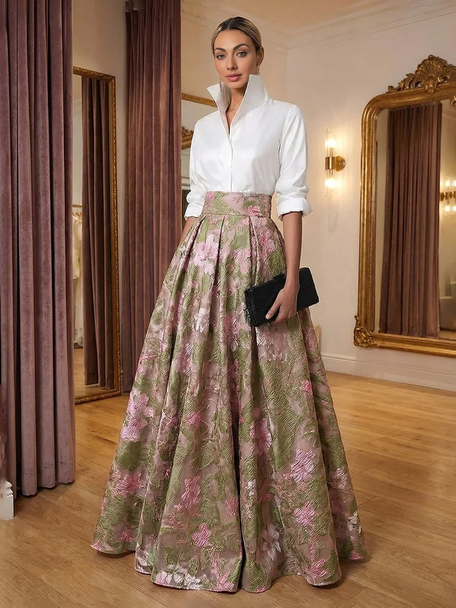 High-neck white top with pleated floral A-line skirt, pink and green
