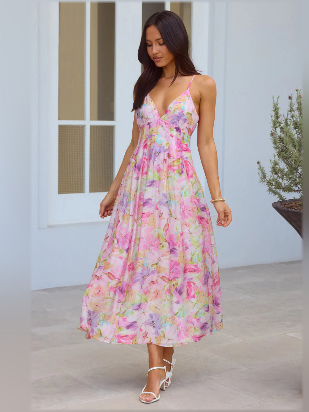 Multicolor floral print midi dress with V-neck and spaghetti straps, tiered flowing skirt