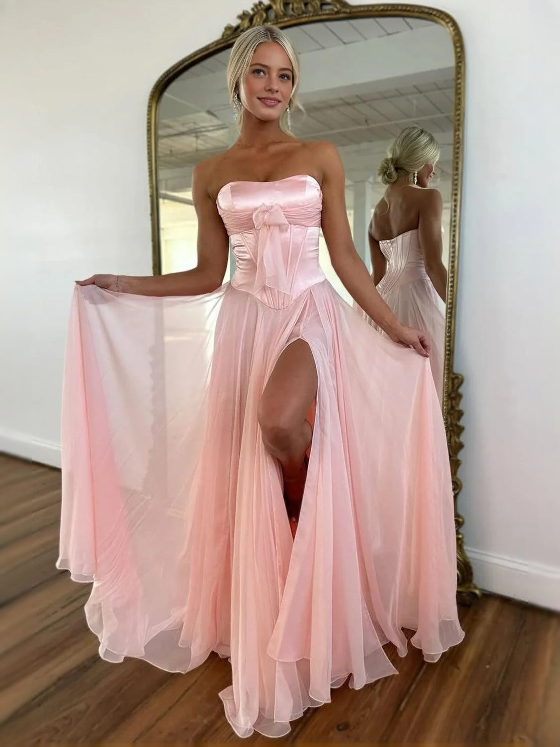 Blush pink strapless corset A-line prom dress with flowing floor-length skirt