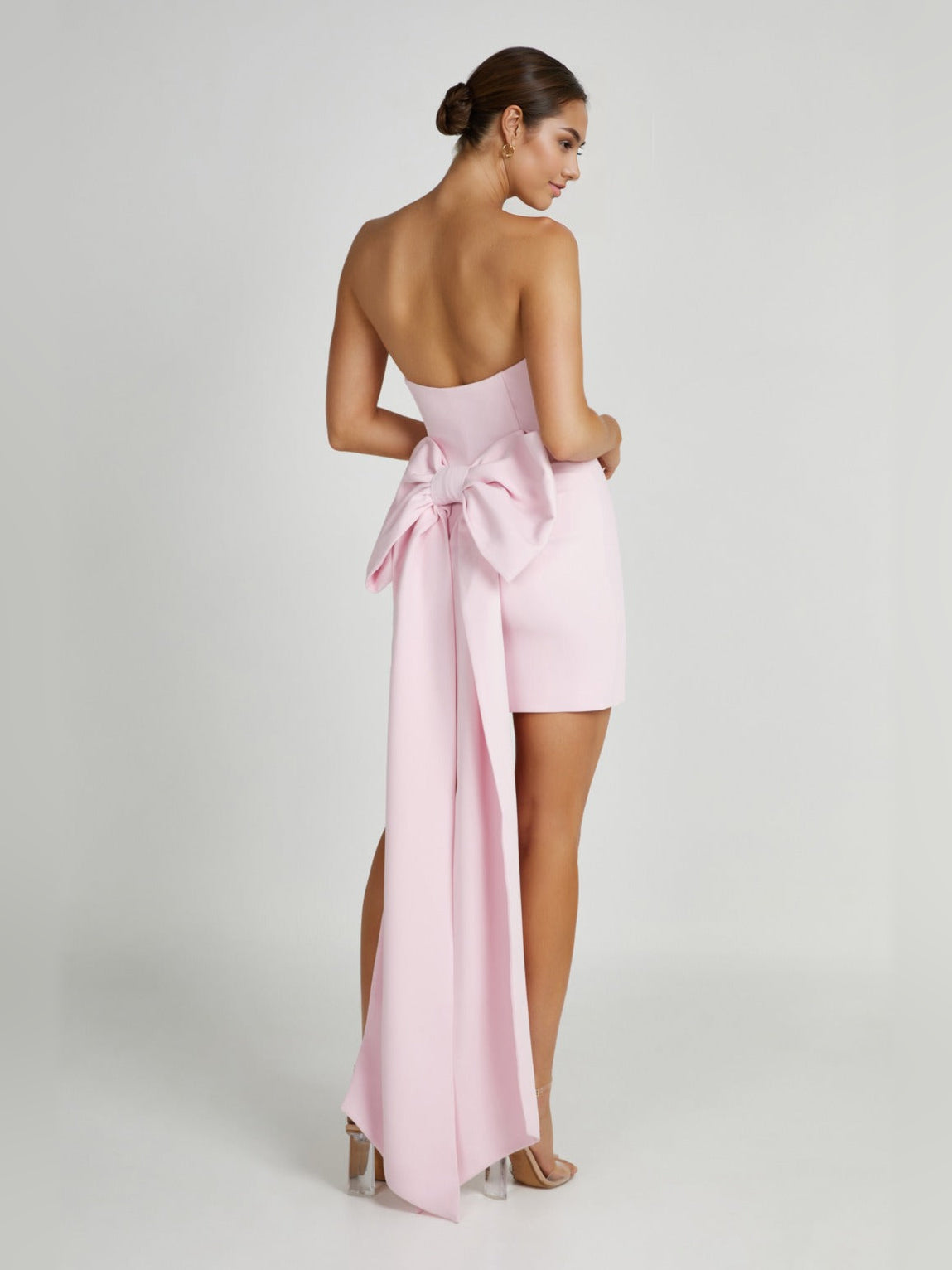Blush pink strapless mini dress with sweetheart neckline and long bow side sash
