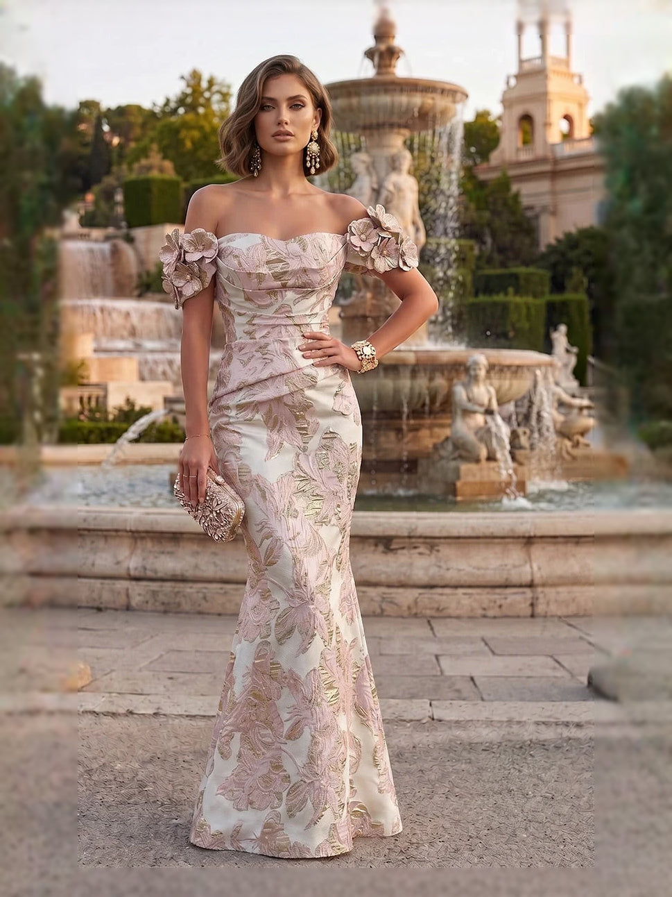 Champagne off-shoulder mermaid gown with ruched bodice and floral applique